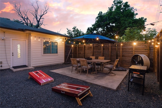 5106 Hardy St, Houston, TX 77009 - patio terrace at dusk with a fenced backyard and a patio