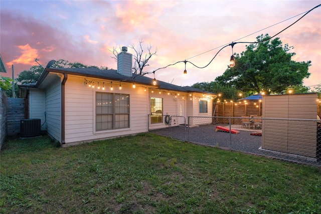 5106 Hardy St, Houston, TX 77009 - rear view of property featuring a chimney, central air condition unit, and a patio