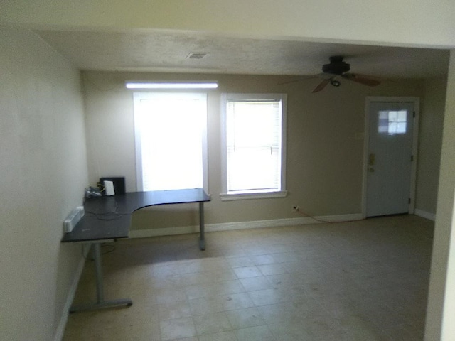 4102 Red Haw Ln, Houston, TX 77022 - spare room featuring ceiling fan, baseboards, and an office area