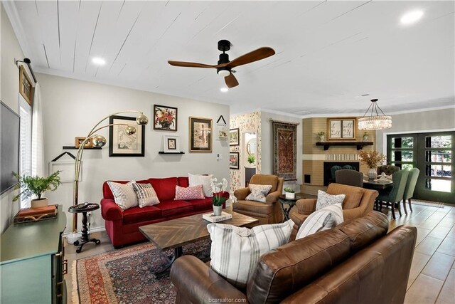 11433 Grassbur Rd, Bryan, TX 77808 - living room featuring ceiling fan, recessed lighting, a brick fireplace, a chandelier, and baseboards