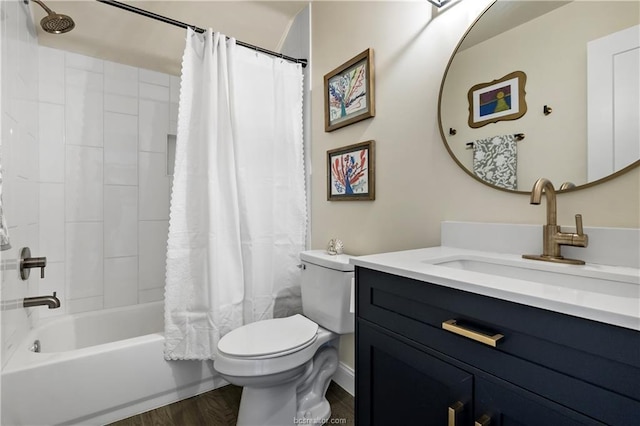 11433 Grassbur Rd, Bryan, TX 77808 - full bathroom featuring toilet, vanity, shower / bath combo with shower curtain, and wood finished floors