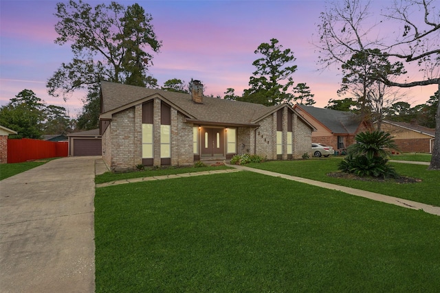 2407 Rambling Brook Dr, Spring, TX 77373 - mid-century modern home featuring brick siding, a chimney, a shingled roof, and driveway