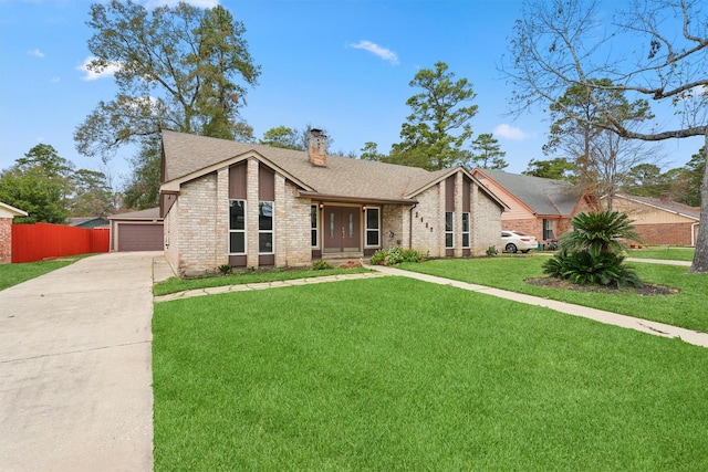 2407 Rambling Brook Dr, Spring, TX 77373 - mid-century modern home featuring a chimney, brick siding, roof with shingles, and concrete driveway