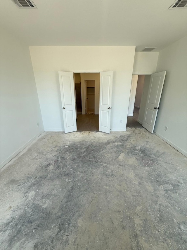 10300 Woodhill Spa Ln, Cleveland, TX 77327 - unfurnished bedroom featuring unfinished concrete flooring and baseboards