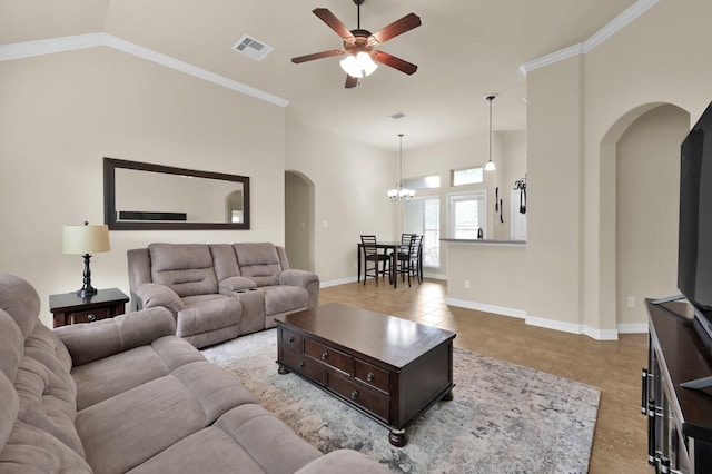 999 Arbor Xing, Conroe, TX 77303 - living area featuring arched walkways, a ceiling fan, light tile patterned floors, a chandelier, and baseboards