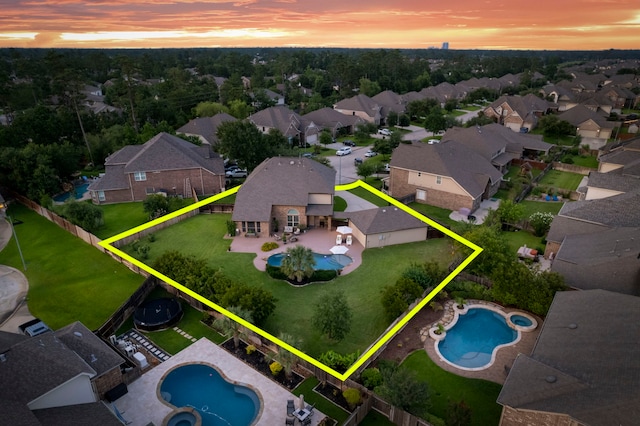 6871 Adrienne Arbor Dr, Spring, TX 77389 - aerial view at dusk of view of pool area, property parcel outlined, and a residential view