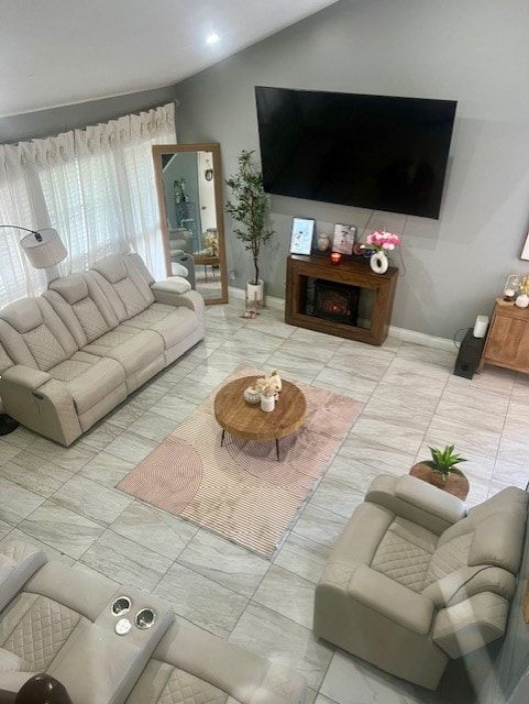 17102 Dewgrass Dr, Houston, TX 77060 - living area featuring vaulted ceiling and baseboards