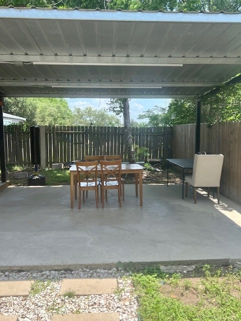 17102 Dewgrass Dr, Houston, TX 77060 - view of patio with outdoor dining space and fence