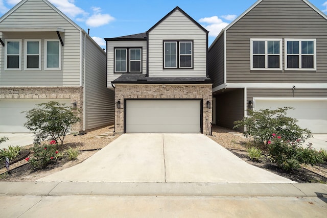 413 Stonework Oaks Ln, Houston, TX 77076 - view of front facade with an attached garage, concrete driveway, and brick siding