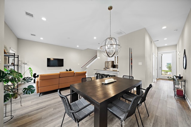 413 Stonework Oaks Ln, Houston, TX 77076 - dining room featuring light wood finished floors, recessed lighting, a chandelier, and baseboards