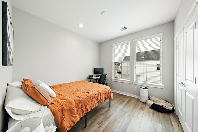 413 Stonework Oaks Ln, Houston, TX 77076 - bedroom with wood finished floors, recessed lighting, baseboards, and an office area