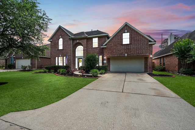 24918 Corbin Gate Dr, Spring, TX 77389 - traditional-style house with brick siding, concrete driveway, a garage, and a front yard