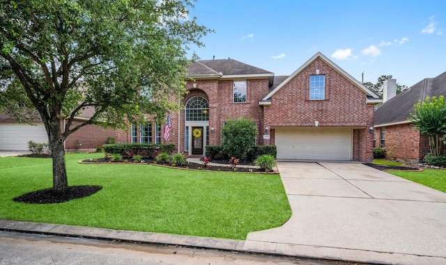 24918 Corbin Gate Dr, Spring, TX 77389 - traditional home with brick siding, concrete driveway, a front yard, and an attached garage