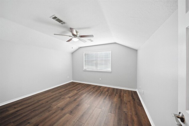 5224 Shorewood Dr, Willis, TX 77318 - additional living space featuring a ceiling fan, dark wood-style flooring, vaulted ceiling, and baseboards