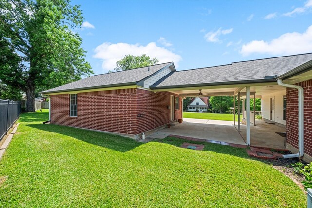 5224 Shorewood Dr, Willis, TX 77318 - view of property exterior featuring a patio area, brick siding, and a shingled roof