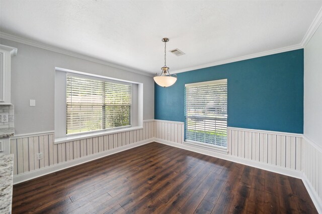 5224 Shorewood Dr, Willis, TX 77318 - spare room featuring dark wood-type flooring, healthy amount of natural light, wainscoting, and ornamental molding