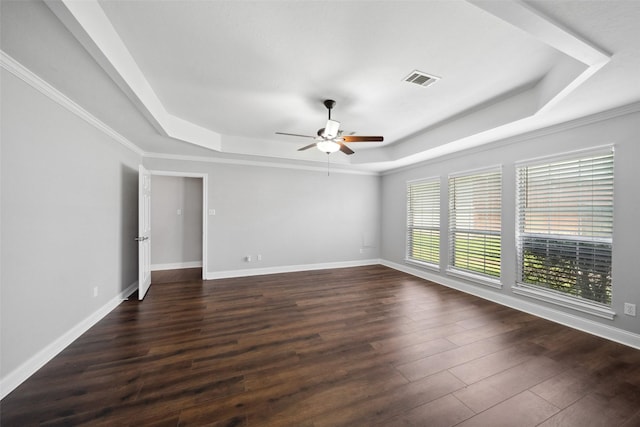 5224 Shorewood Dr, Willis, TX 77318 - spare room with a tray ceiling, a ceiling fan, dark wood-type flooring, baseboards, and ornamental molding