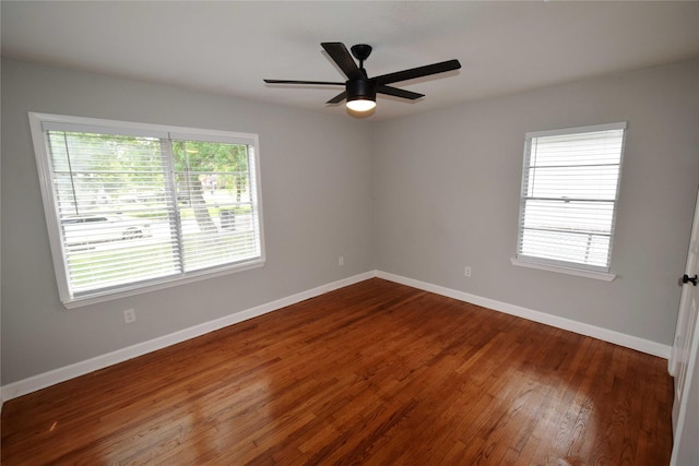 8130 Sharondale Dr, Houston, TX 77033 - spare room featuring dark wood finished floors, baseboards, and ceiling fan