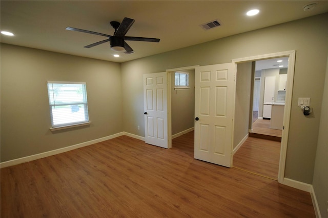 8130 Sharondale Dr, Houston, TX 77033 - unfurnished bedroom with wood finished floors, recessed lighting, baseboards, and a ceiling fan