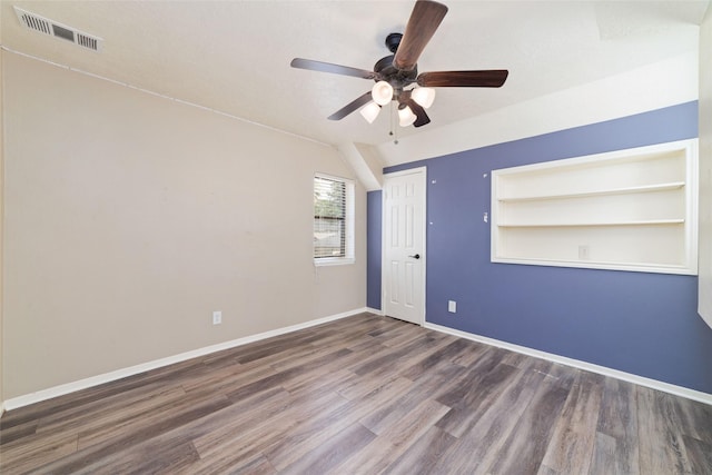 14926 Royal Birkdale St, Houston, TX 77095 - spare room with wood finished floors, a ceiling fan, baseboards, and built in shelves