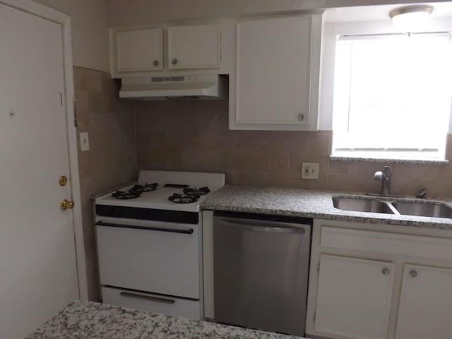 3114 Falk Ct Unit 3114, La Porte, TX 77571 - kitchen featuring under cabinet range hood, white gas range oven, dishwasher, a sink, and white cabinets