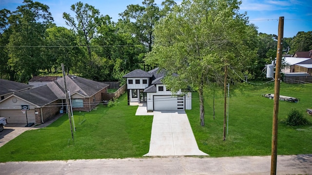 316 E Oakdale St, Dayton, TX 77535 - view of front facade featuring concrete driveway and an attached garage
