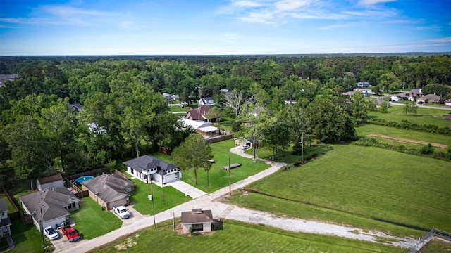 316 E Oakdale St, Dayton, TX 77535 - aerial perspective of suburban area featuring a heavily wooded area