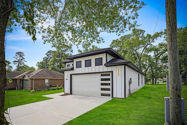 316 E Oakdale St, Dayton, TX 77535 - view of front facade featuring board and batten siding and a front lawn