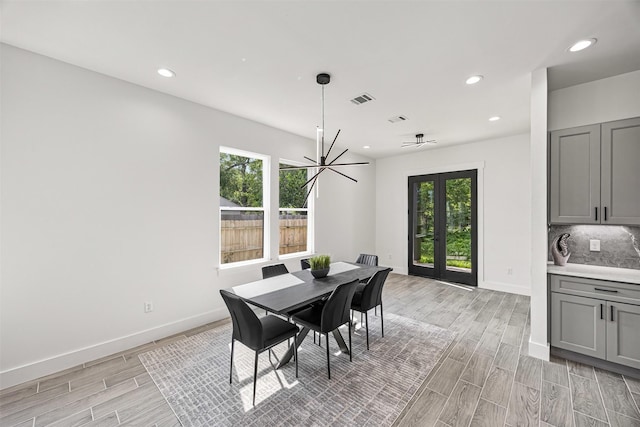 316 E Oakdale St, Dayton, TX 77535 - dining area featuring healthy amount of natural light, light wood-type flooring, recessed lighting, and baseboards