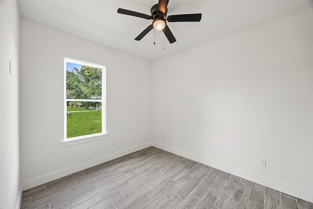 316 E Oakdale St, Dayton, TX 77535 - unfurnished room with light wood finished floors, baseboards, and ceiling fan