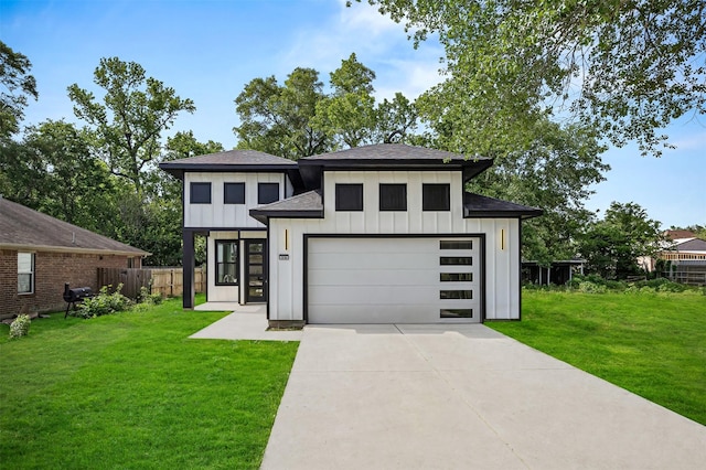 316 E Oakdale St, Dayton, TX 77535 - view of front facade featuring board and batten siding, a shingled roof, driveway, and a garage