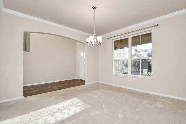 14542 Northern Mountain Ct, Houston, TX 77090 - carpeted empty room with ornamental molding, a chandelier, healthy amount of natural light, arched walkways, and baseboards