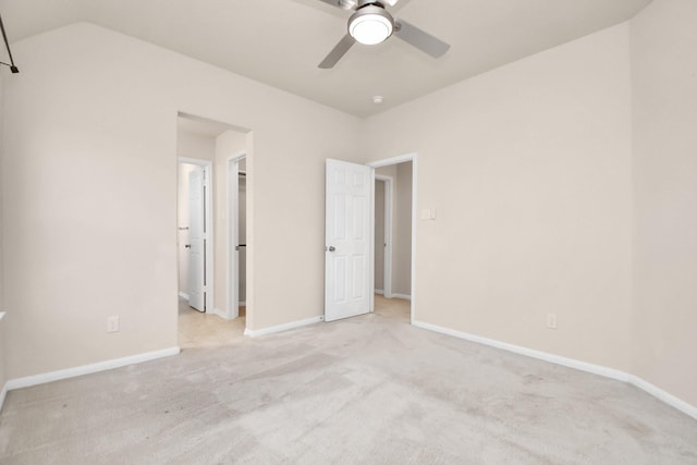14542 Northern Mountain Ct, Houston, TX 77090 - unfurnished bedroom featuring carpet flooring, a spacious closet, baseboards, a ceiling fan, and vaulted ceiling