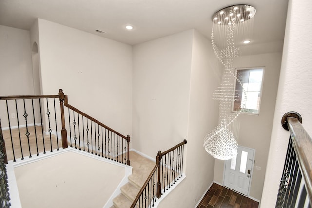 14542 Northern Mountain Ct, Houston, TX 77090 - stairway with a chandelier, wood finished floors, plenty of natural light, recessed lighting, and baseboards