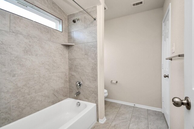 14542 Northern Mountain Ct, Houston, TX 77090 - bathroom with toilet, bathing tub / shower combination, baseboards, and tile patterned flooring