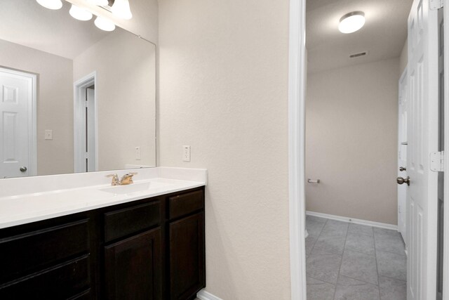 14542 Northern Mountain Ct, Houston, TX 77090 - bathroom featuring vanity, tile patterned floors, and baseboards