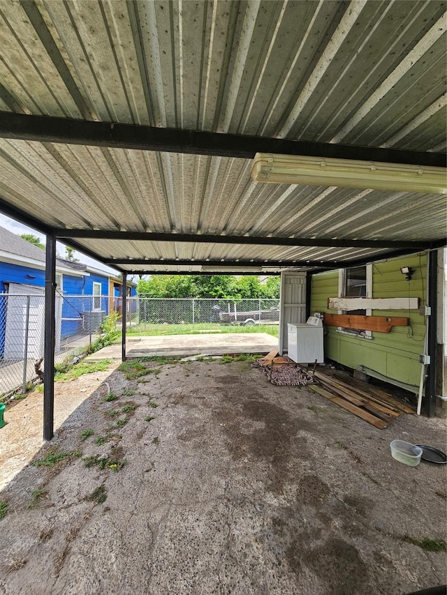 3131 Vintage St, Houston, TX 77026 - garage featuring a carport