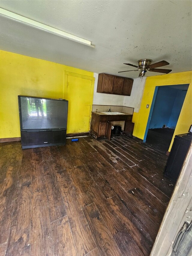 3131 Vintage St, Houston, TX 77026 - unfurnished living room with dark wood-type flooring, a ceiling fan, and baseboards