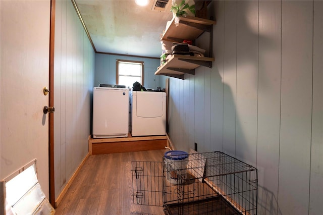 522 Price Dr, San Augustine, TX 75972 - clothes washing area with separate washer and dryer, wood finished floors, and crown molding