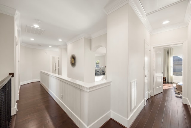 1211 Chamboard Ln, Houston, TX 77018 - hall featuring dark wood-style floors, arched walkways, baseboards, recessed lighting, and ornamental molding