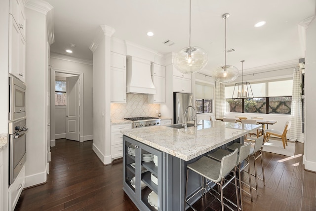 1211 Chamboard Ln, Houston, TX 77018 - kitchen featuring custom range hood, appliances with stainless steel finishes, baseboards, ornamental molding, and tasteful backsplash