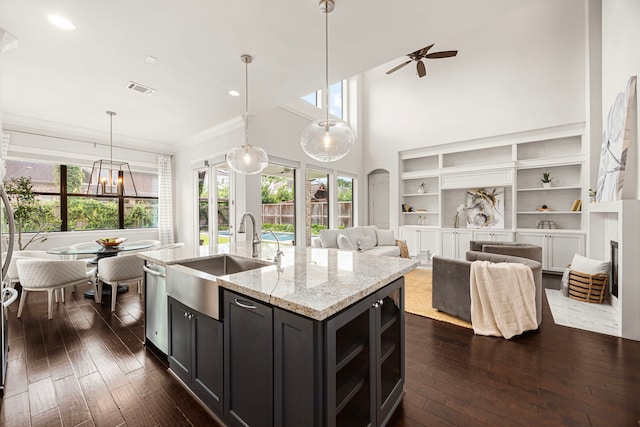 1211 Chamboard Ln, Houston, TX 77018 - kitchen with a sink, stainless steel dishwasher, dark wood finished floors, healthy amount of natural light, and ornamental molding