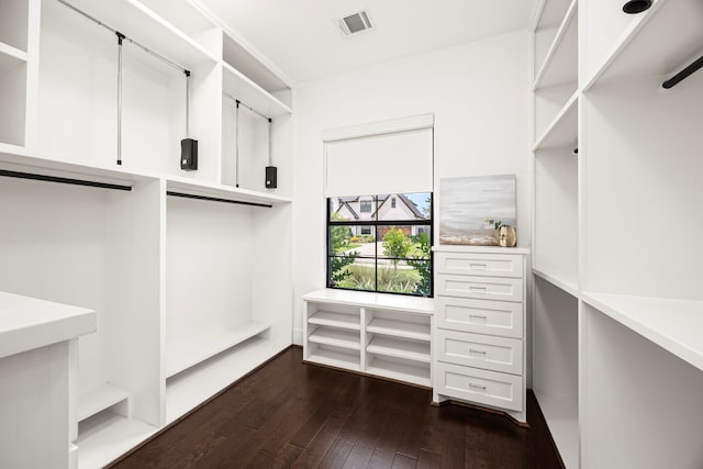 1211 Chamboard Ln, Houston, TX 77018 - walk in closet with dark wood-style flooring