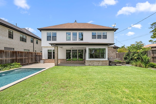 1211 Chamboard Ln, Houston, TX 77018 - rear view of house featuring stucco siding, brick siding, ceiling fan, and a patio
