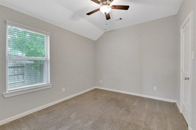 12407 Palo Acebo Ln, Humble, TX 77346 - empty room with a ceiling fan, carpet flooring, baseboards, and vaulted ceiling