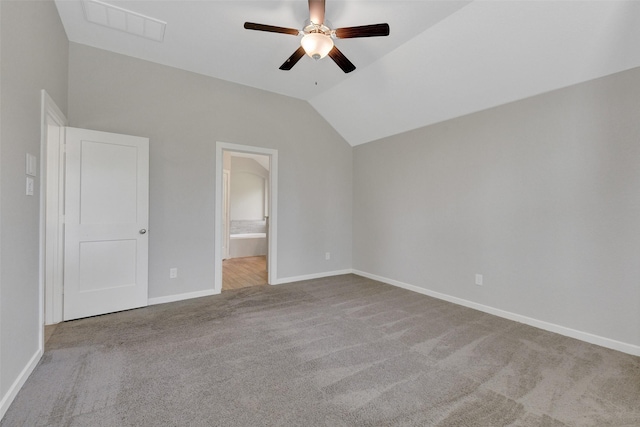 12407 Palo Acebo Ln, Humble, TX 77346 - unfurnished bedroom with carpet floors, vaulted ceiling, baseboards, connected bathroom, and a ceiling fan