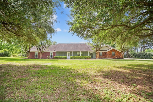 416 State Highway 21 E, Crockett, TX 75835 - ranch-style house featuring a front yard and brick siding