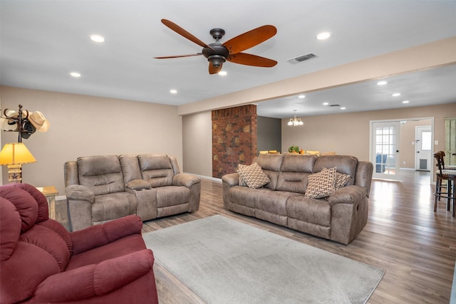 416 State Highway 21 E, Crockett, TX 75835 - living room featuring recessed lighting, wood finished floors, a ceiling fan, a chandelier, and baseboards