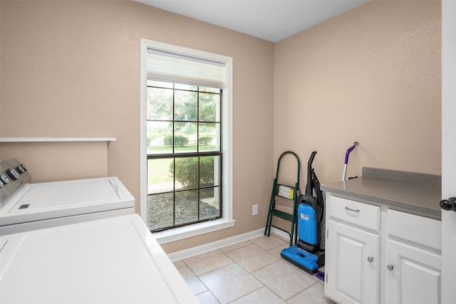 416 State Highway 21 E, Crockett, TX 75835 - clothes washing area with independent washer and dryer, baseboards, light tile patterned floors, and cabinet space
