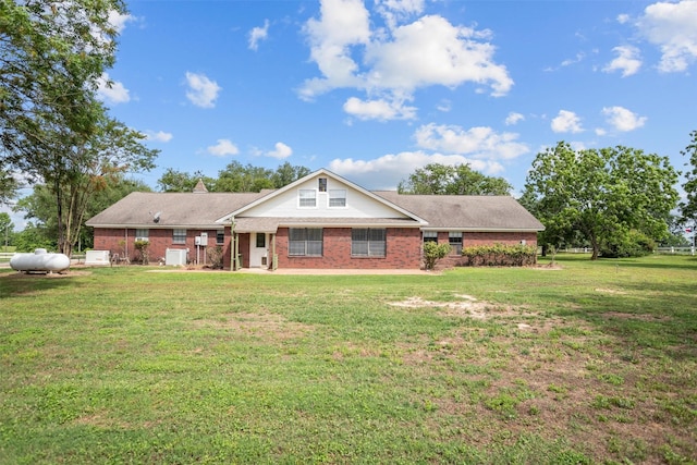 416 State Highway 21 E, Crockett, TX 75835 - view of front of house featuring brick siding and a front yard